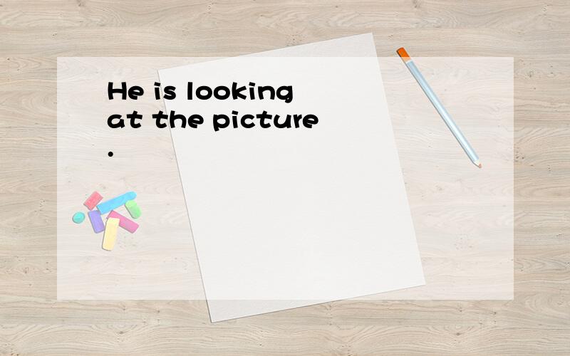 He is looking at the picture.